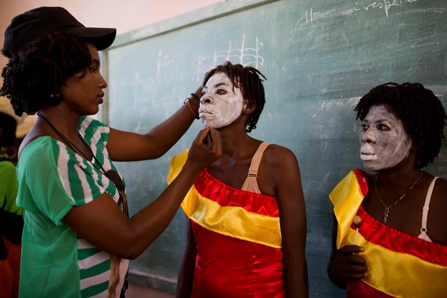 Performers get their makeup done for the Carnival parade in Les Cayes, Haiti, Tuesday, February 28, 2017. Haiti's three-day Carnival festivities have brought rum-fueled parties, imaginative costumes and high-energy dance music to a southern city that's still recovering from last year's punishing Hurricane Matthew. (Photo by Dieu Nalio Chery/AP Photo)
