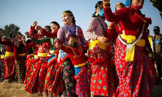 Locals clad in their traditional attires perform Sakela dance to celebrate Ubhauli festival in Tudikhel, on Saturday, January 1, 2022. (Photo by Amit Machamasi/ZUMA Press Wire/Rex Features/Shutterstock)