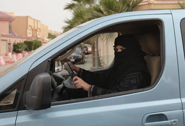 Aziza Yousef drives a car in Riyadh, Saudi Arabia, Saturday, March 29, 2014, as part of a campaign to defy Saudi Arabia's ban on women driving. In the six months since Saudi activists renewed calls to defy the kingdom's ban on female drivers, small numbers of women have gotten behind the wheel almost daily in what has become the country's longest such campaign. (Photo by Hasan Jamali/AP Photo)