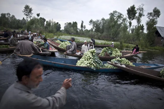 Kashmiri vegetable vendors assemble at a floating market on Dal Lake in Srinagar June 7, 2012. (Photo by Ahmad Masood/Reuters)