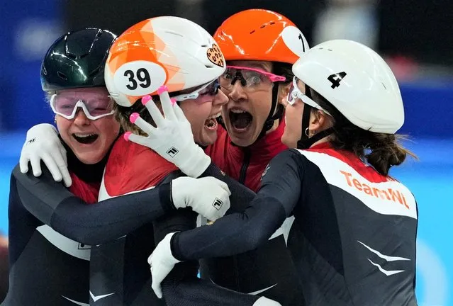 Yara van Kerkhof of the Netherlands, Selma Poutsma of the Netherlands, Suzanne Schulting of the Netherlands, Xandra Velzeboer of the Netherlands celebrating during the Short Track Speed Skating – Women's 3000m Relay on day 9 of the Beijing 2022 Olympic Games at the National Speedskating Oval on February 13, 2022 in Beijing, China. (Photo by Aleksandra Szmigiel/Reuters)