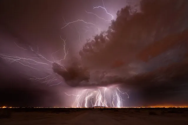 Heavy lightning strikes hit the ground just south of Casa Grande, including Arizona City and the Tohono O'odham Nation in July 2013. (Photo by Mike Olbinski/Barcroft Media)