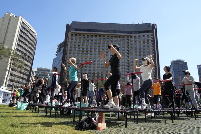 Participants perform as they attend the jumping fitness during Seoul Heath Show at Seoul Plaza in Seoul, South Korea, Tuesday, May 14, 2024. (Photo by Ahn Young-joon/AP Photo)