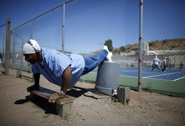 Martell Collins, 51, does push-ups in the exercise yard at San Quentin state prison in San Quentin, California, June 8, 2012. (Photo by Lucy Nicholson/Reuters)