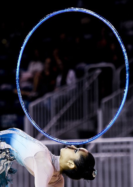 Venezuela's Grisbel Lopez performs with the hoop during the Gymnastic Rhythmic Group all-around competition at the Pan Am Games in Toronto, Friday, July 17, 2015. (Photo by Nathan Denette/The Canadian Press via AP Photo)