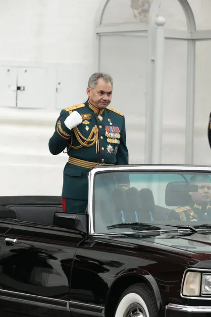 Russian Defense Minister Sergei Shoigu crosses himself as he is driven along Red Square during the Victory Day military parade to celebrate 72 years since the end of WWII and the defeat of Nazi Germany, in Moscow, Russia, on Tuesday, May 9, 2017. (Photo by Ivan Sekretarev/AP Photo)