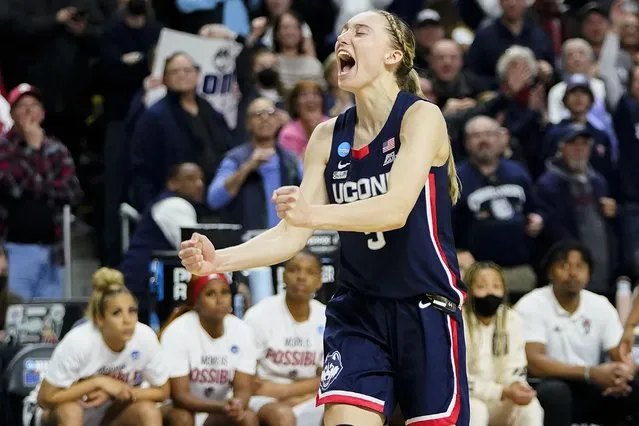 Connecticut guard Paige Bueckers (5) reacts in double overtime against NC State during the East Regional final college basketball game of the NCAA women's tournament, Monday, March 28, 2022, in Bridgeport, Conn. (Photo by Frank Franklin II/AP Photo)