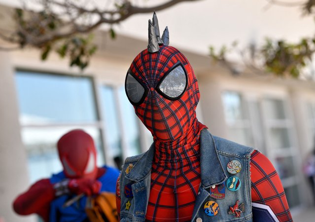 A Spiderman cosplayer walks outside the convention center during Comic Con International in San Diego, California, July 28, 2024. (Photo by Chris Delmas/AFP Photo)