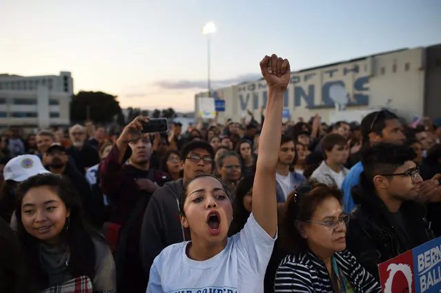 UCLA student, Maral Milani, center, cheers for presidential candidate, Bernie Sanders as he speaks at a rally at Santa Monica High School on Monday May 23, 2016 in Santa Monica, CA. The primary in California is June 7th. (Photo by Matt McClain/The Washington Post)