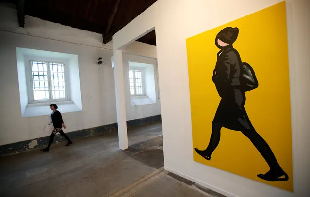 A woman walks next to an art piece by British artist Julian Opie during the International Contemporary Art (ARCO) fair in Lisbon, Portugal May 25, 2016. (Photo by Rafael Marchante/Reuters)