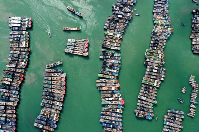 A drone view shows fishing boats being moored at a port as Typhoon Gaemi approaches, in Lianjiang county of Fuzhou, Fujian province, China on July 23, 2024. (Photo by Reuters/China Daily)