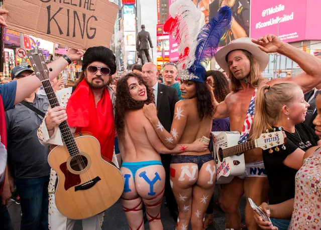 Billy Ray Cyrus performs as Burnin Vernon Brown with The Naked Cowboy in Times Square to promote the season two premiere of “Still The King” airing July 11 at 10/9c on CMT, on July 10, 2017 in New York City. (Photo by Noam Galai/Getty Images for CMT)