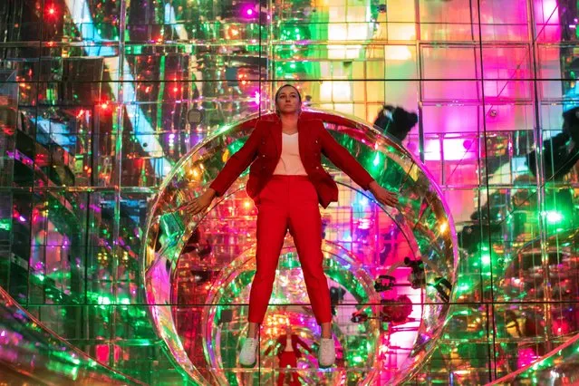 A woman attends the preview of SUMMIT One Vanderbilt observation deck, which is spread across the top four floors of the new One Vanderbilt tower in Midtown Manhattan, in New York City, New York, U.S., October 18, 2021. (Photo by Eduardo Munoz/Reuters)