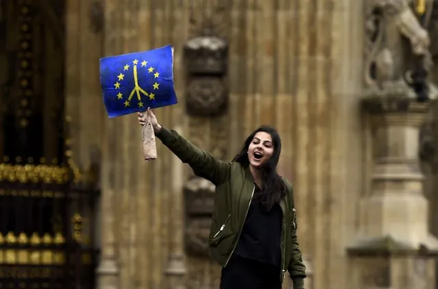 A demonstrator stands outside the Houses of Parliament during a protest aimed at showing London's solidarity with the European Union following the recent EU referendum, in central London, Britain June 28, 2016. (Photo by Dylan Martinez/Reuters)
