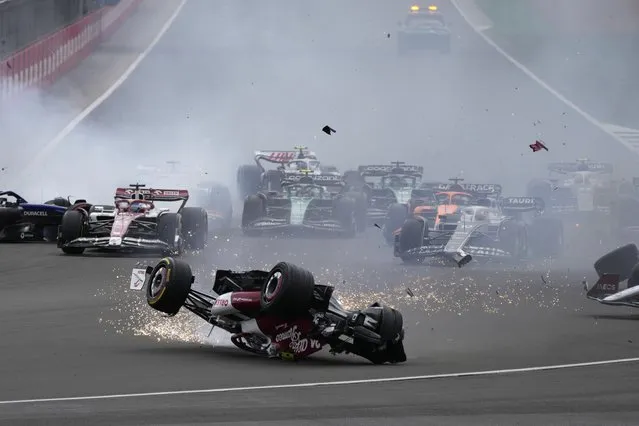 Alfa Romeo driver Guanyu Zhou of China crashes at the start of the British Formula One Grand Prix at the Silverstone circuit, in Silverstone, England, Sunday, July 3, 2022. (Photo by Frank Augstein/AP Photo)