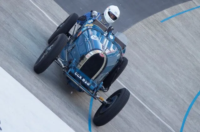 Juerg Koenig drives a 1926 Bugatti 37 A race car during the Indianapolis in Oerlikon race demonstration at the Offene Rennbahn cycling track in Zurich's Oerlikon suburb, Switzerland on July 26, 2022. (Photo by Arnd Wiegmann/Reuters)