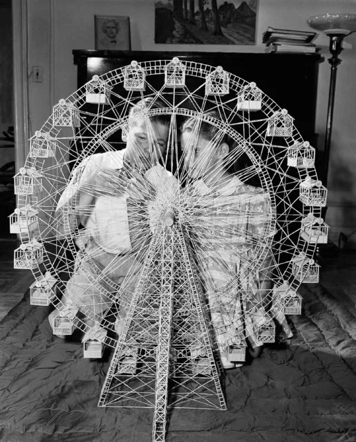 14-year-old Barry Pariser, checks on the movable ferris wheel which he built out of toothpicks as his sister Linda looks on in New York, September 6, 1948. This is the young hobbyist's most ambitious project, which took 27,000 toothpicks and four months to build. Barry began his toothpick building at the age of ten, at the suggestion of his father. (Photo by Ed Ford/AP Photo)