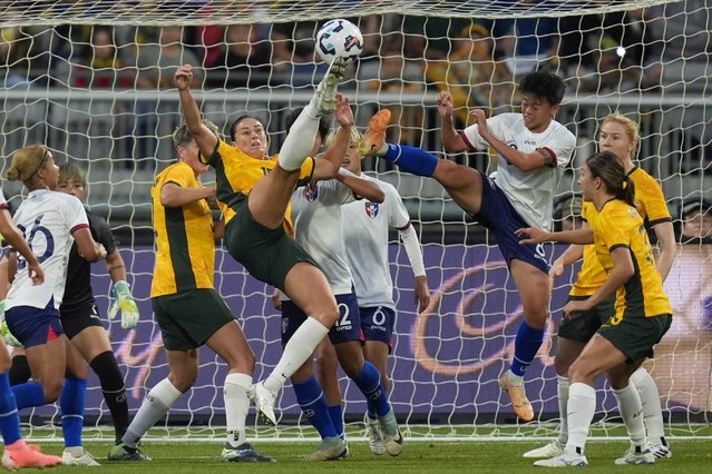 Matilda's Emily Gielnik and Taiwan's Li Yi-wen compete to kick the ball during a friendly soccer international between Australia and Taiwan in Geelong, Australia, Saturday, December 7, 2024. (Photo by Asanka Brendon Ratnayake/AP Photo)