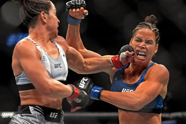 Danyelle Wolf (blue gloves) kicks Norma Dumont of Brazil (red gloves) in a featherweight fight during the UFC 279 event at T-Mobile Arena on September 10, 2022 in Las Vegas, Nevada. (Photo by Joe Camporeale/USA TODAY Sports)