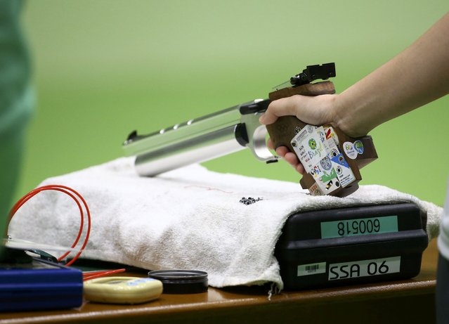2016 Rio Olympics, Shooting, Preliminary, Women's 10m Air Pistol Qualification, Olympic Shooting Centre, Rio de Janeiro, Brazil on August 7, 2016. The pistol of Teo Shun Xie (SIN) of Singapore is seen during warm-up. (Photo by Jeremy Lee/Reuters)