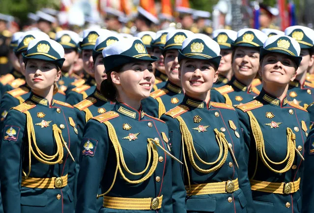 Russian servicewomen march during the Victory Day Parade in Red Square in Moscow, Russia, June 24, 2020. The military parade, marking the 75th anniversary of the victory over Nazi Germany in World War Two, was scheduled for May 9 but postponed due to the outbreak of the coronavirus disease (COVID-19). (Photo by Sergey Pyatakov/Host Photo Agency/AFP Photo)