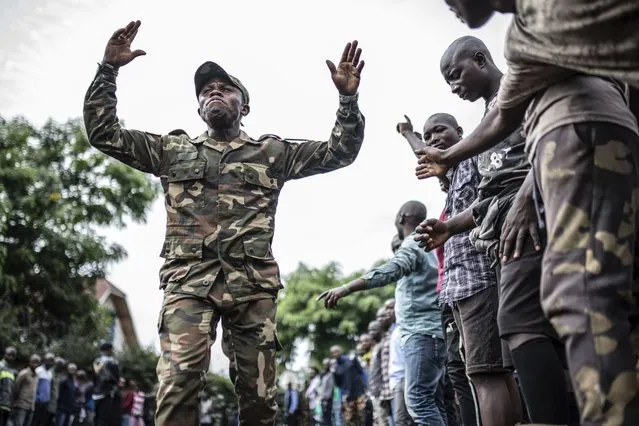 Democratic Republic of the Congo youth get the first steps of basic military training in Goma, eastern Congo, Monday, November 7, 2022. (Photo by Moses Sawasawa/AP Photo)