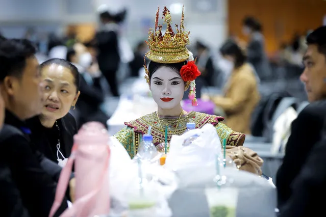 A dancer in make up waits to perform at the Queen Sirikit National Convention Center, the venue of the Asia-Pacific Economic Cooperation (APEC) Summit in Bangkok, Thailand, 14 November 2022. Thailand will host the summit for economic cooperation, comprising 21 leading member economies to promote free trade in the Asia-Pacific region, from 18 to 19 November 2022. (Photo by Diego Azubel/EPA/EFE)