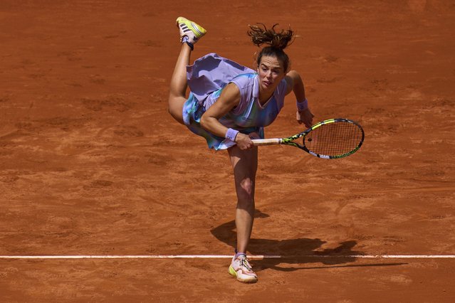 Lucia Bronzetti of Italy serves against Naomi Osaka of Japan during the Madrid Open tennis tournament in Madrid, Spain, Tuesday, April 22, 2025. (Photo by Manu Fernandez/AP Photo)