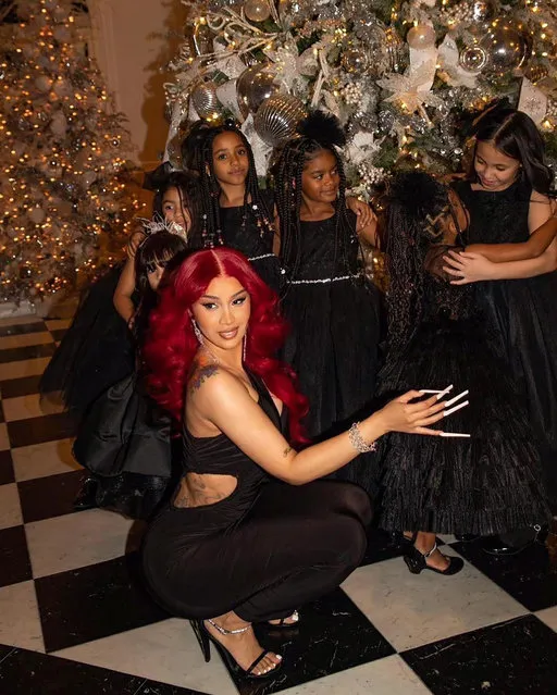 American rapper and songwriter Belcalis Marlenis Almánzar Cephus, known professionally as Cardi B attempts to wrangle kids for a family photo in the last decade of December 2022. (Photo by iamcardib/Instagram)