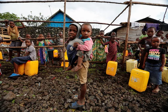 Children are pictured at a water point in Bugamba district of Goma, the capital of North Kivu, eastern Democratic Republic of Congo, September 30, 2019. (Photo by Zohra Bensemra/Reuters)