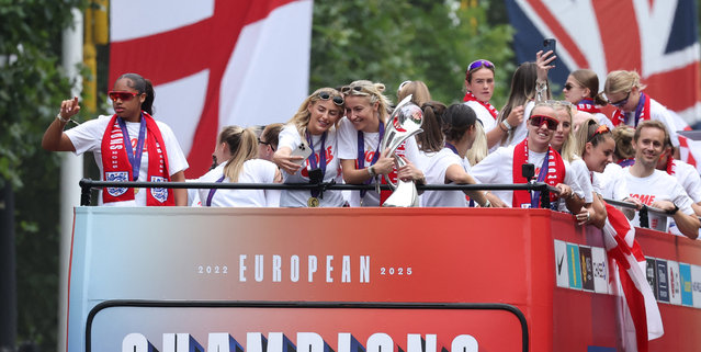 England’s Chloe Kelly takes a selfie with Leah Williamson during the team’s parade on the Mall, London on July 29, 2025. (Photo by Toby Melville/Reuters)
