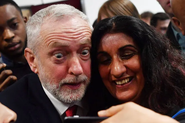 Opposition Labour party leader Jeremy Corbyn poses for a selfie after giving a speech on Brexit at Coventry University in Coventry on February 26, 2018. Corbyn called for “a new comprehensive UK- EU customs union” after Brexit on Monday in a major policy shift that could force Prime Minister Theresa May' s government to change course. (Photo by Ben Stansall/AFP Photo)