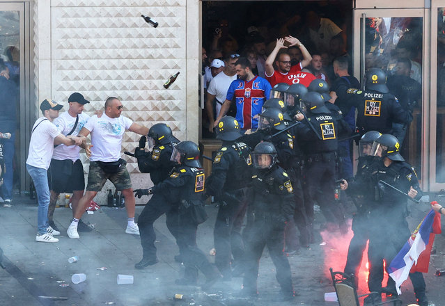 Serbia fans clash with police officers as they gather in Munich before their Euro match against Denmark, in Munich, Germany on June 25, 2024. (Photo by Christian Mang/Reuters)