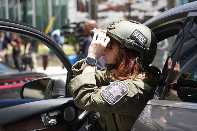 A nurse with the Fulton County police SWAT team works at the scene of a shooting near a medical facility on May 3, 2023 in Atlanta, Georgia. Police say four people were injured and one killed in the shooting and the suspect is still at large. (Photo by Megan Varner/Getty Images)