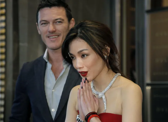 Taiwanese actress Shu Qi gestures as she poses with British actor Luke Evans during a promotional event for Bulgari in Hong Kong, Thursday, January 15, 2015. (Photo by Vincent Yu/AP Photo)
