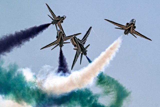 BAE Hawk trainer aircraft of the Royal Saudi Air Force's Saudi Falcons aerobatic team release smoke as they perform manoeuvres during the first Egypt International Airshow at Alamein International Airport in Alamein in northern Egypt on September 4, 2024. (Photo by Khaled Desouki/AFP Photo)