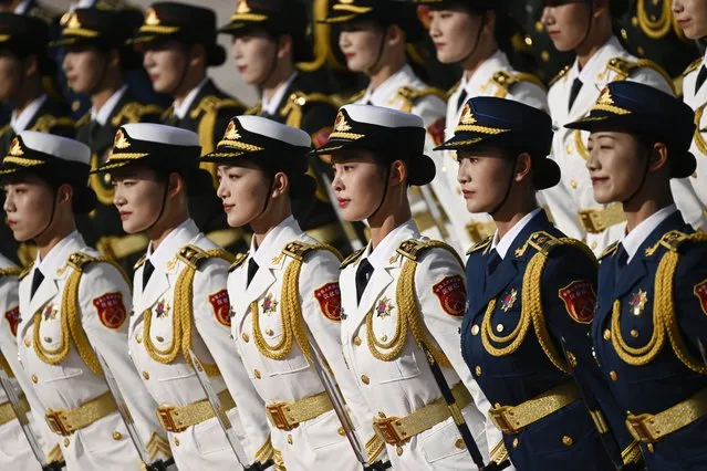 Chinese honour guards prepare for the arrival of Honduran President Xiomara Castro (not pictured) and Chinese President Xi Jinping (not pictured) during a welcome ceremony outside the Great Hall of the People in Beijing, China, 12 June 2023. (Photo by Wang Zhao/Pool via EPA)
