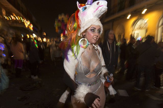 A member of Krewe Delusion, one of the first parades of the Mardi Gras festivities, marches through the French Quarter of New Orleans January 31, 2015. (Photo by Lee Celano/Reuters)