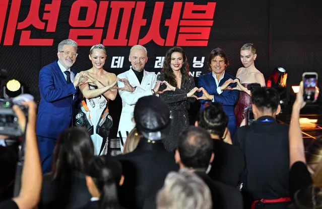 (L-R) American film director Christopher McQuarrie, French actress Pom Klementieff, British actor Simon Pegg, British-American actress Hayley Atwell, American actor Tom Cruise and British actress Vanessa Kirby pose for a photo during a red carpet event for the film “Mission Impossible – Dead Reckoning Part One” in Seoul on June 29, 2023. (Photo by Jung Yeon-Je/AFP Photo)
