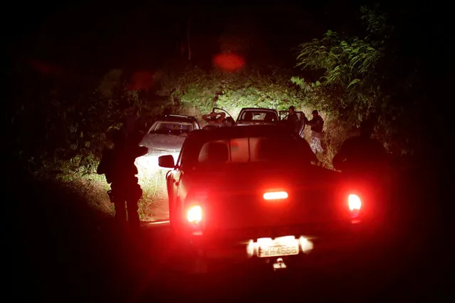 Soldiers of military police approach a suspect during an operation to combat illegal mining and logging, conducted by agents of the Brazilian Institute for the Environment and Renewable Natural Resources, or Ibama, in the municipality of Novo Progresso, Para State, northern Brazil, November 10, 2016. (Photo by Ueslei Marcelino/Reuters)