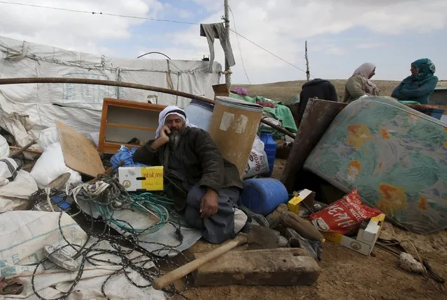 A Palestinian man sits among the rubble of his house, which was demolished by Israeli bulldozers, in the West Bank village of Jimba, southern Hebron February 2, 2016. Israeli troops demolished several homes belonging to Palestinians in southern Hebron on Tuesday in territory disputed by Palestinians and Israelis after local residents said they were informed the area had been declared a military zone by the Israeli army. (Photo by Mussa Qawasma/Reuters)