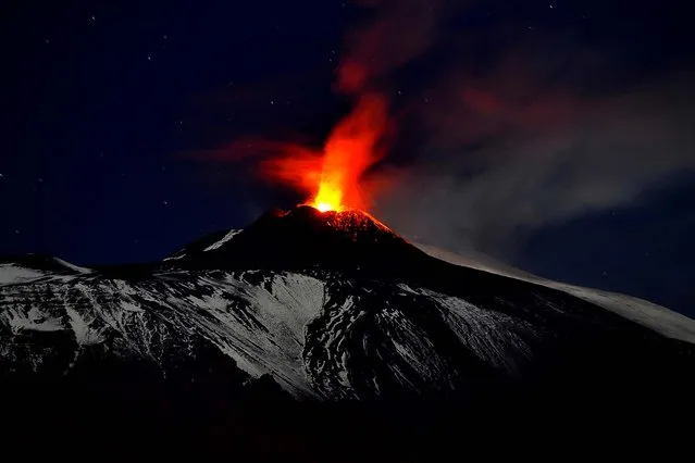 Mt. Etna spews lava during an eruption, seen from Acireale, near the Sicilian town of Catania on November 16, 2013. (Photo by Carmelo Imbesi/Associated Press)