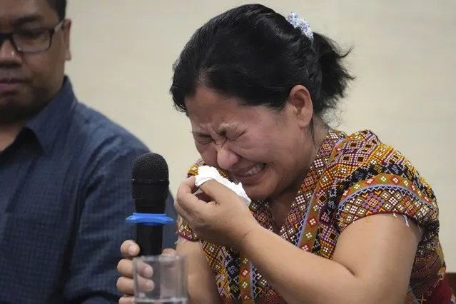 Burmese Zing Raltu breaks into tears as she talks to reporters after filing a criminal complaint against Myanmar's top generals at the Department of Justice in Manila, Philippines on Wednesday October 25, 2023. Relatives of victims of alleged war crimes committed by Myanmar’s military filed a criminal complaint in the Philippines against their nation’s ruling generals in a desperate attempt to test whether such a case could succeed outside the violence-wracked country.(Photo by Aaron Favila/AP Photo)