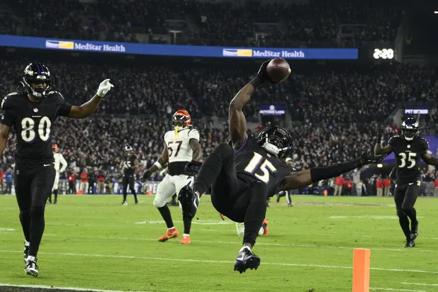 Baltimore Ravens wide receiver Nelson Agholor (15) scores a touchdown in the first half of an NFL football game against the Cincinnati Bengals in Baltimore, Thursday, November 16, 2023. (Photo by Nick Wass/AP Photo)