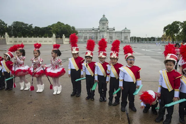 Children in colorful uniforms gather for a memorial ceremony for late King Chulalongkorn at Royal Plaza in Bangkok on October 23, 2018. The national memorial day marks the anniversary of King Chulalongkorn passing away, who died on October 23, 1910 after ruling Siam – as Thailand was known then – for 42 years. (Photo by Romeo Gacad/AFP Photo)