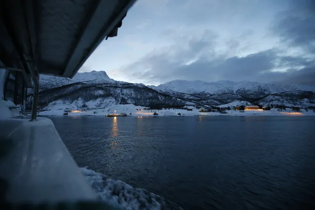 In this photo taken Tuesday, February 2, 2016, the morning ferry arrives at the island of Seiland, northern Norway, where a number of asylum seekers are housed in temporary accommodation at the Altnes camp. (Photo by Alastair Grant/AP Photo)