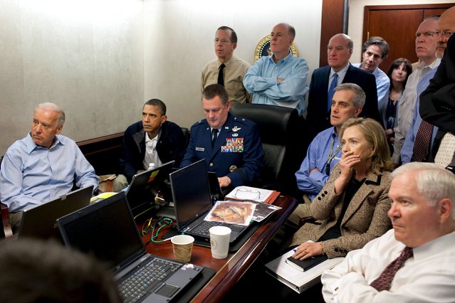U.S. President Barack Obama (2nd L) and Vice President Joe Biden (L) and Secretary of State Hillary Clinton (seated, 2nd R), along with members of the national security team, receive an update on the mission against Osama bin Laden in the Situation Room of the White House, in this May 1, 2011 file photo. (Photo by White House/Reuters)