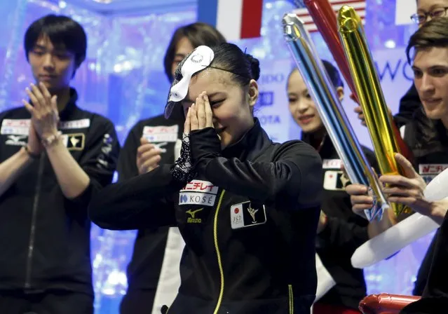 Kanako Murakami (C) of Japan reacts at the “kiss and cry” after completing her ladies' free skating program at the ISU World Team Trophy in Figure Skating in Tokyo April 18, 2015. (Photo by Yuya Shino/Reuters)