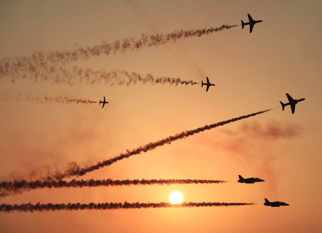 The Saudi Hawks Display Team performs Thursday, January 16, 2014, at the Bahrain International Airshow in Sakhir, Bahrain. Bahrain's state news agency says the International Airshow opened to announcements of more than $3 billion in agreements. (Photo by Hasan Jamali/AP Photo)
