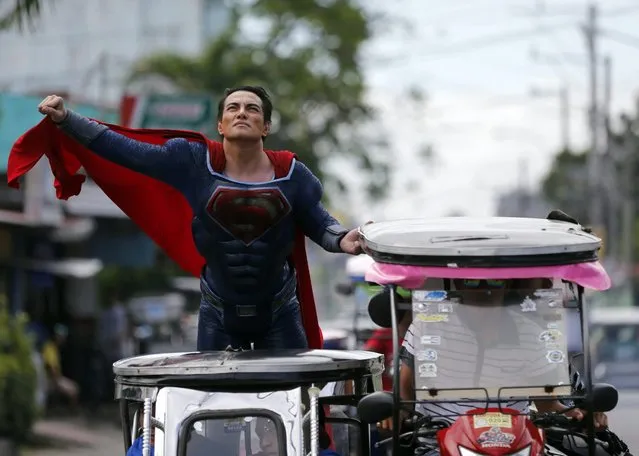 Filipino Herbert Chavez wearing a Superman costume, rides a three wheeled motorcycle in Calamba city, Laguna province, Philippines, 03 March 2016. According to Chavez, he is an obsessed Superman fanatic who went through cosmetic surgery on his body and face to look alike his heroic alter-ego, Superman. (Photo by Francis R. Malasig/EPA)